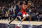 Raptors' Scottie Barnes looks to shoot while Timberwolves' Nathan Knight defends during the first quarter at Target Center on Thursday, Jan. 19, 2023. 