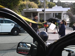 Law enforcement work an investigation of an early morning shooting that left three people dead and four wounded, on Jan. 28, 2023, in the Beverly Crest neighbourhood of Los Angeles, just north of Beverly Hills.