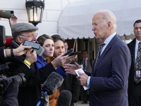 U.S. President Joe Biden talks with reporters before he and first lady Jill Biden board Marine One on the South Lawn of the White House in Washington, D.C., Wednesday, Jan. 11, 2023.