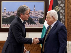 Palestinian President Mahmud Abbas (right) and U.S. Secretary of State Antony Blinken shake hands following their meeting in Ramallah in the occupied West Bank, on Jan. 31, 2023.