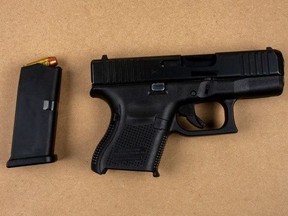 Two men face charges after this loaded handgun and a quantity of ammunition were seized, along with $350,000 in solen appliances and electronics, in Peel Region.