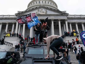 In this file photo taken on January 6, 2021 supporters of President Donald Trump protest outside the US Capitol in Washington, DC.