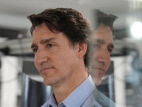 As Canada's allies pledge tanks for Ukraine, Prime Minister Justin Trudeau gave no indication Monday morning on whether Ottawa will follow suit. Trudeau is reflected in a glass door as he addresses media after touring Xanadu Quantum Technologies in Toronto, Monday, Jan.23, 2023.