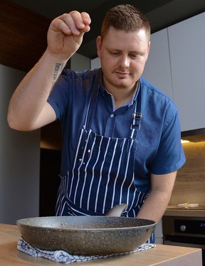 Chef Jade Berg adds seasoning to seafood chowder.