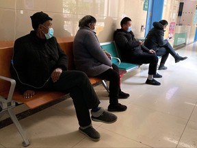 This picture taken on Jan. 5, 2023 shows COVID-19 patients resting in a hallway at Fengyang People's Hospital in Fengyang county, east China's Anhui Province.