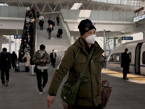 This picture taken on Jan. 5, 2023 shows a man wearing a face mask amid the COVID-19 pandemic arriving at a train station in Bengbu, east China's Anhui Province.