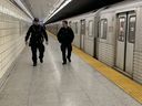 Toronto Police Consts. Greg Henkenhaf and Dave Donaldson on patrol at Spadina TTC station on Jan. 26, 2023. 