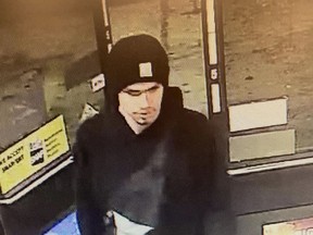 This surveillance video image released by the Yakima Police Department shows a suspect sought in a shooting at a convenience store in Yakima, Wash., early on Tuesday, Jan. 24, 2023.