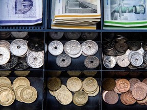 Mixed denomination Danish kroner banknotes and coins sit in a cash register in Copenhagen, Denmark.