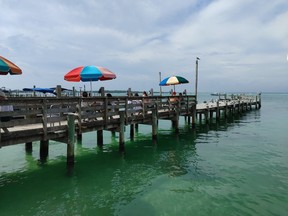 The views from the waterside Dewey Destin’s Seafood Restaurant, a charmingly rustic eatery owned by a relative of the city’s founder.