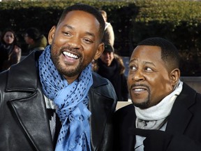 Co-stars Will Smith, left, and Martin Lawrence appear at a photo call for their film "Bad Boys for Life", in Paris on Jan. 6, 2020.