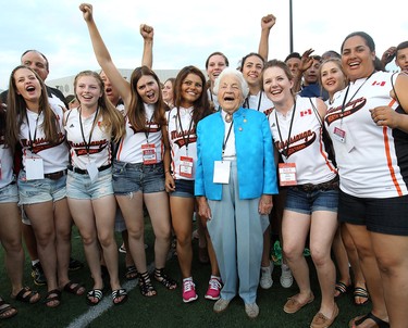 Mississauga Mayor Hazel McCallion poses with the team from the University of Windsor at the Alumni Field during the opening ceremony for the Ontario Summer Games in Windsor, Ont., Aug. 7, 2014. (Dan Janisse/Windsor Star)