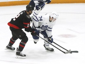 Toronto Maple Leafs centre Bobby McMann (74) and Ottawa Senators defenceman Artem Zub (2) battle for the puck during second period NHL pre-season action at the CAA arena in Belleville, Ont., on Friday, September 30, 2022.