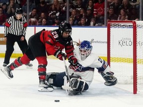 United States goaltender Nicole Hensley (29) stops Canada's Marie-Philip Poulin (29) on a penalty shot during overtime Rivalry Series hockey action in Kelowna, B.C., Tuesday, Nov. 15, 2022. Canada's women's hockey team needs back-to-back wins against the U.S. to win their Rivalry Series.