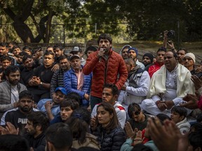 Indian wrestler Bajrang Punia, center, speaks during a protest against Wrestling Foundation of India President Brij Bhushan Charan Singh and other officials in New Delhi, India, Thursday, Jan. 19, 2023. Top India wrestlers led a sit-in protest near the parliament building on Thursday accusing the federation president and coaches of sexually and mentally harassing young wrestlers.