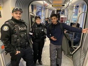 Antonio Hernandez, a mechanical engineering student from Mexico, felt safer seeing two Toronto Police officers riding the Spadina TTC streetcar on the first day of a new initiative that will see cops patrolling the transit system starting Thursday, Jan. 26, 2023.