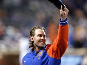 FILE - New York Mets' Jeff McNeil gestures to fans during the fourth inning of the team's baseball game against the Washington Nationals on Oct. 5, 2022, in New York. McNeil and the Mets finalized a $50 million, four-year contract Tuesday, Jan. 31, 2023 that avoided a salary arbitration hearing.