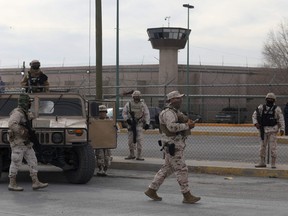 Members of the Mexican Army secure an area outside the prison of Ciudad Juarez number 3 after an attack in Ciudad Juarez, Chihuahua state, on Jan. 1, 2023.