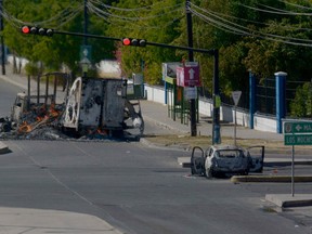 Burnt vehicles are seen on the street during an operation to arrest Ovidio Guzman, in Culiacan, Mexico, on January 5, 2023.