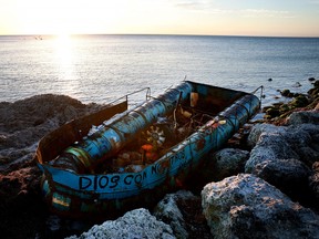A boat that was left along the shoreline after it was used recently to transport Cuban migrants from the island nation to America on Jan. 6, 2023 in Key West, Fla.