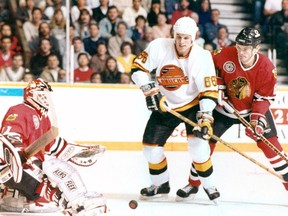 Gino Odjick in a game against the Chicago Blackhawks in 1990.