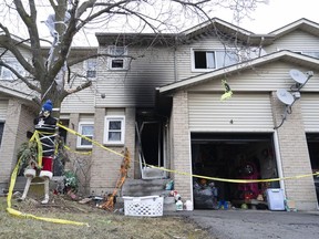 The residence at 14 Derby Street, Unit 4, is shown in Hamilton, Ont. on Friday, December 30, 2022. Hamilton Police and the Office of the Ontario Fire Marshall are investigating the fatal fire that claimed the lives of two adults and two children. Brandy Rennick's seven-year-old son has placed a small stuffed toy on the empty classroom chair next to his to remember his good friend Khaleesi McIsaac who sat with him before she died in a fire.