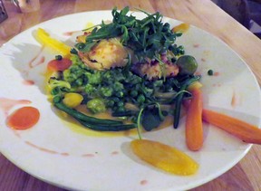 The Almost-Crusted Cod at On the Rocks in Calabogie, Ont., sits on top a bed of arugula risotto with saffron sauce and veggies. Jordan Ercit/Toronto Sun