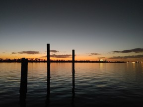 The sun sets over St. Andrews Bay in Panama City Beach.