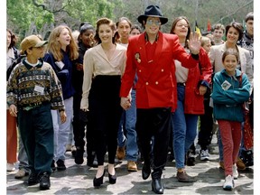 Michael Jackson and wife Lisa Marie Presley-Jackson welcome children from around the world as they arrive for a World Children's Conference at Jackson's Neverland Valley Ranch, Calif., April 18, 1995.
