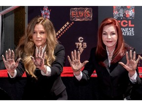 Lisa Marie Presley and her mother Priscilla Presley pose after placing their handprints in cement at TCL Chinese theatre in Los Angeles, Calif., June 21, 2022.