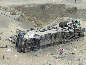 This handout picture released by GP Canal news agency shows a bus accident in the Peruvian region of Piura, north of Lima, on Jan. 28, 2023. Bodies of the deceased have been blurred in the photo.