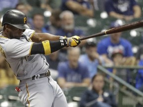 Pittsburgh Pirates' Andrew McCutchen hits his 200th career home run during the first inning of a baseball game against the Milwaukee Brewers, Wednesday, Sept. 13, 2017, in Milwaukee.