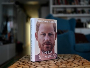 A copy of the "En la sombra" (In the shadow) Spanish version of Prince Harry's autobiography "Spare" is pictured at a reader's home in Madrid on Jan. 5, 2023, despite the publication date set at Jan. 10 with stringent measures in place.