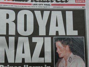 Prince Harry is pictured on the cover of the New York Post wearing a Nazi outfit in January 2005.