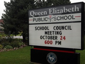 A sign outside Queen Elizabeth Public School in Leamington, Ont., is pictured in this file photo taken on Sept. 23, 2011.