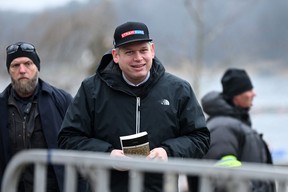 The leader of the far-right Danish political party Stram Kurs, Swedish-Danish politician Rasmus Paludan is pictured while holding the Qur’an during a protest outside the Turkish Embassy in Stockholm, Sweden, on Jan. 21, 2023.