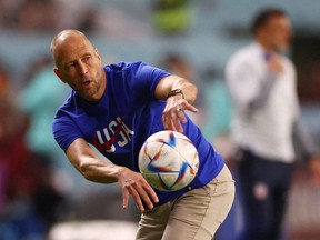 FIFA World Cup Qatar 2022 - Round of 16 - Netherlands v United States - Khalifa International Stadium, Doha, Qatar - December 3, 2022. U.S. coach Gregg Berhalter throws a ball during the match.