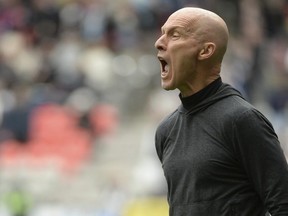Toronto FC head coach Bob Bradley reacts during the second half against the Vancouver Whitecaps at BC Place.