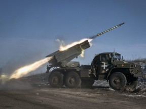 Ukrainian army Grad multiple rocket launcher fires rockets at Russian positions in the frontline near Soledar, Donetsk region, Ukraine, Jan. 11, 2023.
