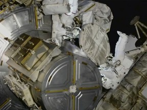 This photo provided by NASA, astronauts Nicole Mann and Koichi Wakata venture out on a spacewalk at the International Space Station on Friday, Jan. 20, 2023.