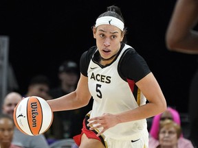 Las Vegas Aces' Dearica Hamby dribbles up court during a WNBA basketball game against the Phoenix Mercury on May 6, 2022 in Phoenix.