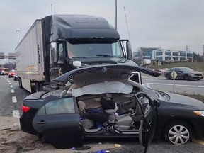 A Toyota Corolla was broadsided by a transport truck when it suddenly pulled out from the shoulder of the Hwy. 403/QEW eastbound ramp to Fairview St., in Burlington, on Monday, Jan. 9, 2023.