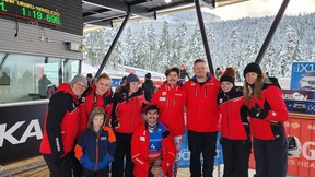 Chef Jade Berg (third from right) huddles with members of the Canadian National Luge Team. (Photo by Brooke Apshkrum)