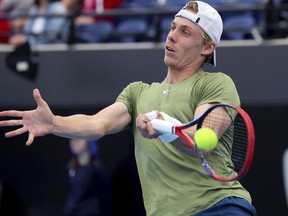 Canada's Denis Shapovalov makes a forehand return to Russia's Roman Safiullin during their Round of 16 match at the Adelaide International Tennis tournament in Adelaide, Australia, Thursday, Jan. 5, 2023.