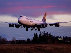 The final Boeing 747 lands at Paine Field following a test flight, Tuesday, Jan. 10, 2023, in Everett, Wash.