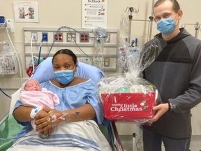 Parents Teshanda Gilling and Blake Sedore hold Brook, who came into the world at 12:04 a.m. at Etobicoke General Hospital.