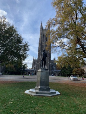 Ecumenical Duke Chapel’s 64-metre gothic spire looms behind the James B. Duke statue. Lance Hornby/Toronto Sun