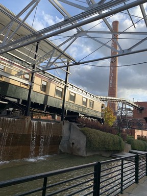 The smokestack of the one-time signature Lucky Strike cigarettes looms over a waterfall at the American Tobacco Campus in Durham, N.C. Lance Hornby/Toronto Sun