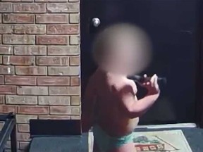 A boy is seen outside an apartment with a gun in video footage captured on a neighbour’s doorbell camera in Beech Grove, Ind.