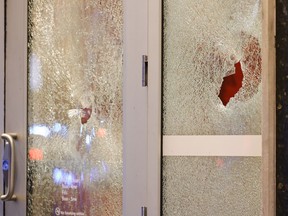 Broken windows at a Wells Fargo branch are seen following a protest, Saturday, Jan. 21, 2023, in Atlanta, in the wake of the death of an environmental activist killed after authorities said the 26-year-old shot a state trooper.